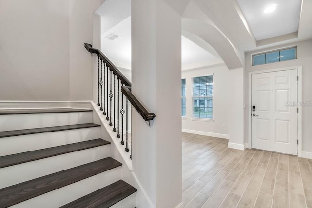 16146 Point Rock Dr, Winter Garden, FL 34787 - foyer entrance with arched walkways and wood finished floors