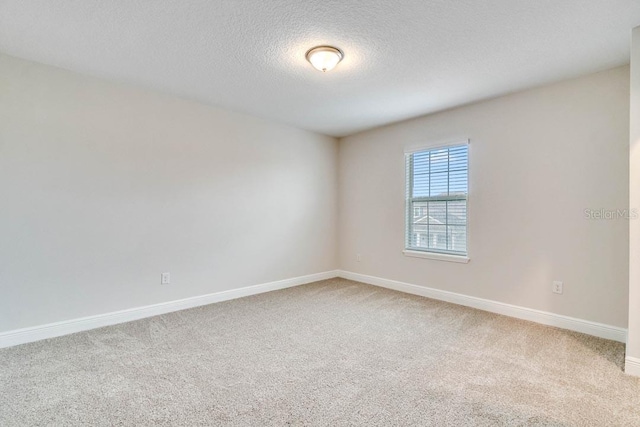 16146 Point Rock Dr, Winter Garden, FL 34787 - unfurnished room with light colored carpet and a textured ceiling