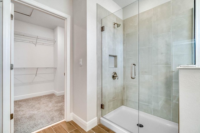 16146 Point Rock Dr, Winter Garden, FL 34787 - full bath featuring a shower stall, a spacious closet, and wood finished floors