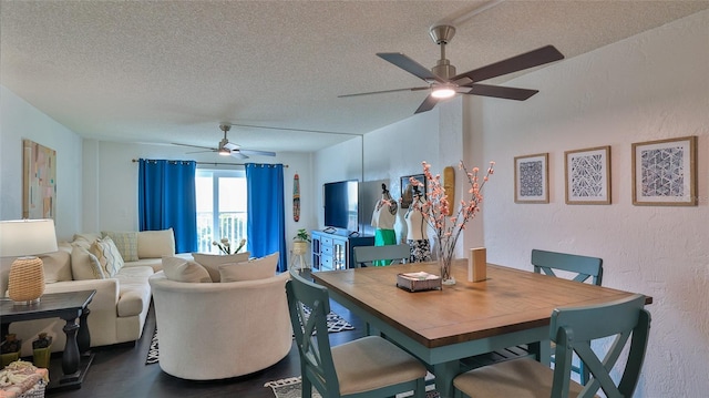 145 N Halifax Ave Unit 705, Daytona Beach, FL 32118 - dining area with ceiling fan, a textured ceiling, a textured wall, and dark wood-type flooring