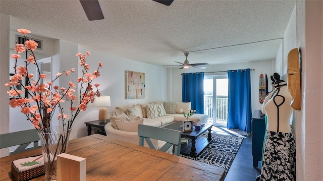 145 N Halifax Ave Unit 705, Daytona Beach, FL 32118 - living area featuring a ceiling fan, a textured ceiling, and wood finished floors