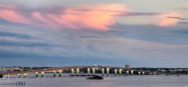 145 N Halifax Ave Unit 705, Daytona Beach, FL 32118 - view of community with a pier, covered parking, and a water view