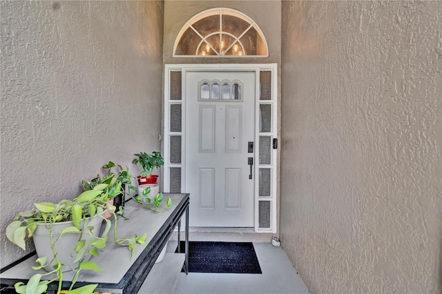 2235 Meadowmouse St, Orlando, FL 32837 - doorway to property with stucco siding