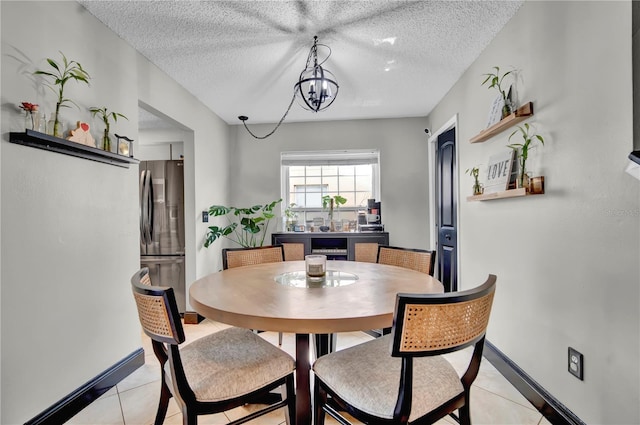 2235 Meadowmouse St, Orlando, FL 32837 - dining space with light tile patterned flooring and a textured ceiling