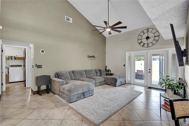 2235 Meadowmouse St, Orlando, FL 32837 - living room featuring washer / clothes dryer, high vaulted ceiling, ceiling fan, light tile patterned floors, and french doors
