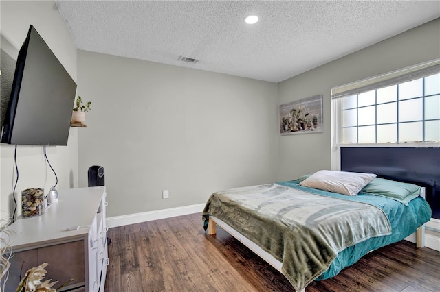 2235 Meadowmouse St, Orlando, FL 32837 - bedroom featuring a textured ceiling, wood finished floors, and recessed lighting