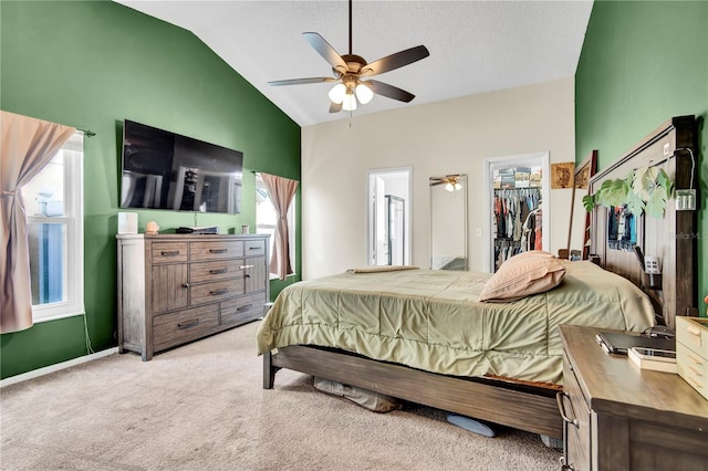 2235 Meadowmouse St, Orlando, FL 32837 - bedroom featuring lofted ceiling, a spacious closet, light carpet, a ceiling fan, and a closet
