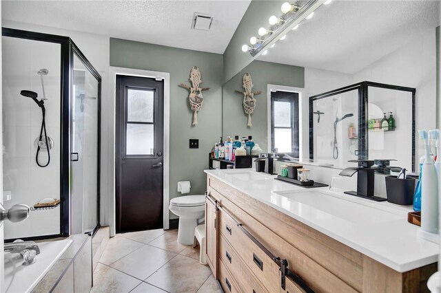 2235 Meadowmouse St, Orlando, FL 32837 - full bath with a shower stall, vanity, a textured ceiling, healthy amount of natural light, and tile patterned floors