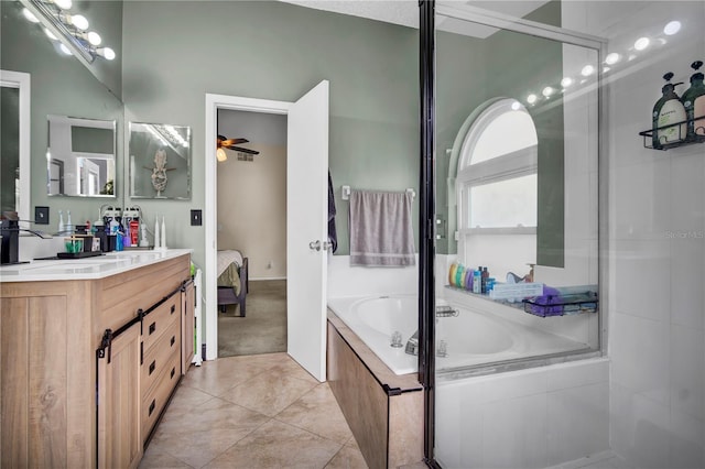 2235 Meadowmouse St, Orlando, FL 32837 - bathroom featuring vanity, ensuite bathroom, a garden tub, tile patterned flooring, and ceiling fan