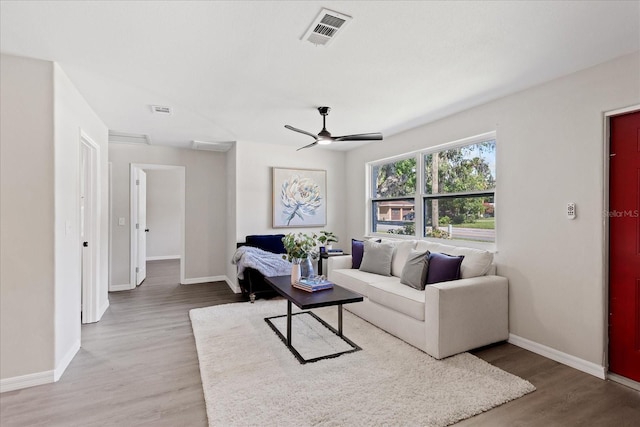 370 Hand Ave, Ormond Beach, FL 32174 - living area featuring light wood finished floors and ceiling fan