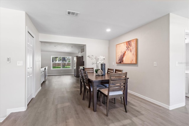 370 Hand Ave, Ormond Beach, FL 32174 - dining space with light wood-type flooring and recessed lighting