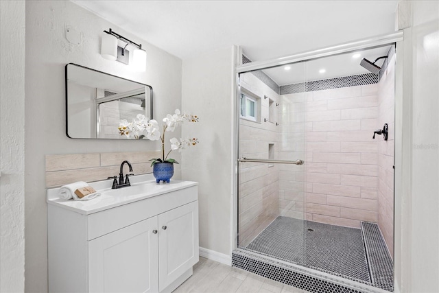 370 Hand Ave, Ormond Beach, FL 32174 - bathroom featuring a stall shower, vanity, and recessed lighting