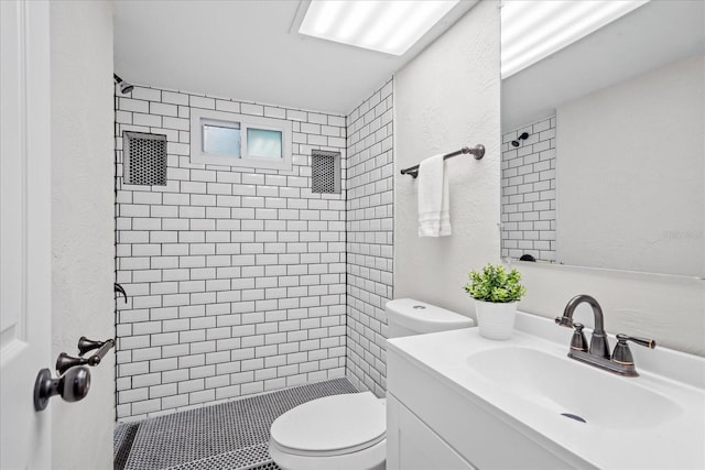 370 Hand Ave, Ormond Beach, FL 32174 - full bath featuring a stall shower, a textured wall, and vanity