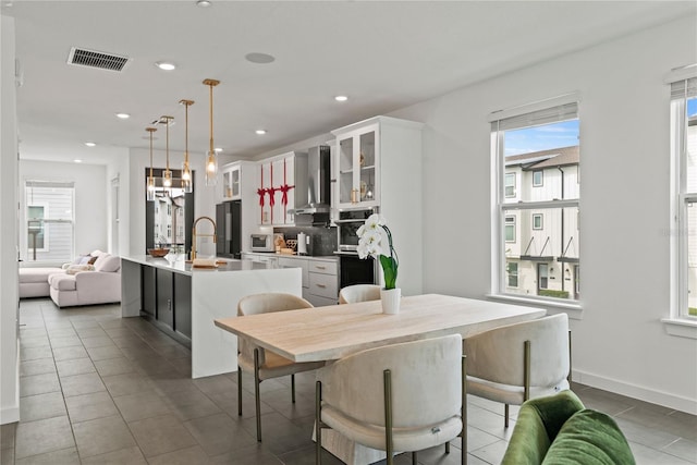 12468 Koshiba Aly, Orlando, FL 32827 - dining area featuring plenty of natural light, recessed lighting, and tile patterned floors
