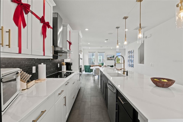 12468 Koshiba Aly, Orlando, FL 32827 - kitchen featuring wall chimney exhaust hood, black electric cooktop, dishwasher, a large island, and tasteful backsplash