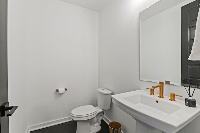 12468 Koshiba Aly, Orlando, FL 32827 - bathroom featuring toilet and baseboards