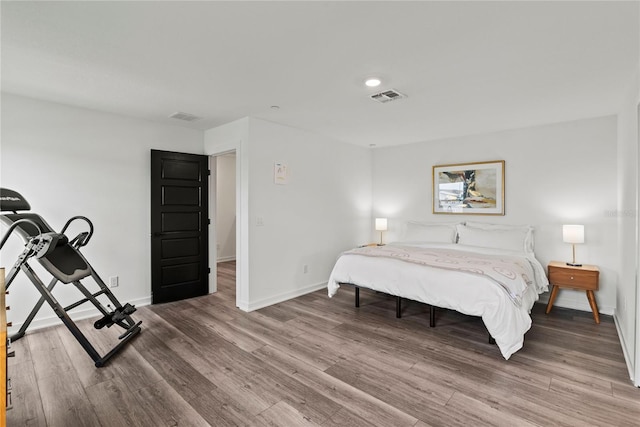 12468 Koshiba Aly, Orlando, FL 32827 - bedroom with light wood finished floors and recessed lighting