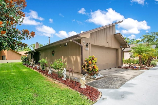 545 Mystic Wood St, Casselberry, FL 32707 - view of property exterior with an attached garage, a yard, driveway, and a chimney