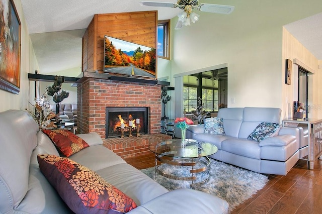 545 Mystic Wood St, Casselberry, FL 32707 - living room featuring ceiling fan, a brick fireplace, wood finished floors, and a high ceiling