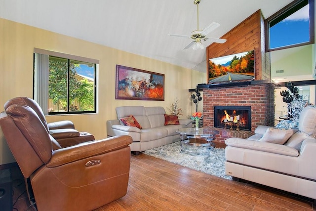 545 Mystic Wood St, Casselberry, FL 32707 - living room featuring high vaulted ceiling, wood finished floors, a ceiling fan, and a brick fireplace