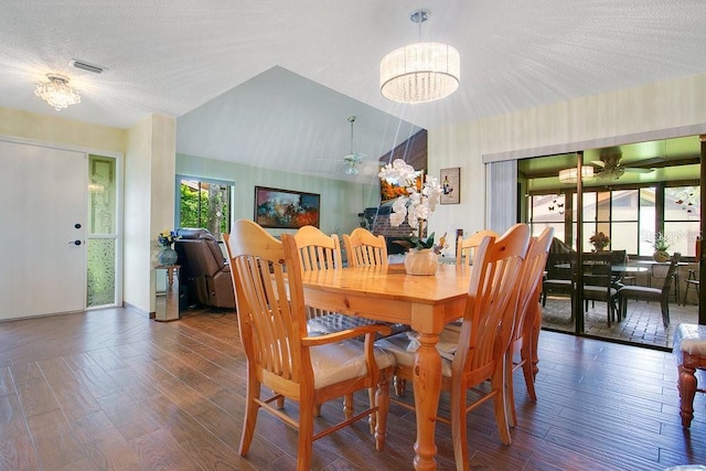 545 Mystic Wood St, Casselberry, FL 32707 - dining room with ceiling fan, wood finished floors, a chandelier, and lofted ceiling