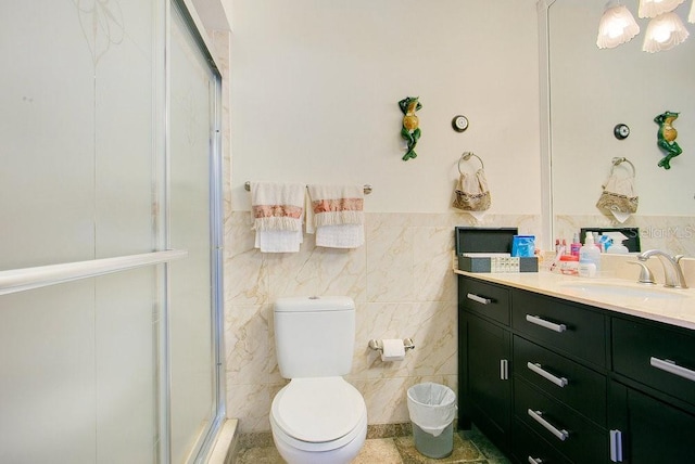 545 Mystic Wood St, Casselberry, FL 32707 - full bath with vanity, tile walls, a stall shower, and wainscoting