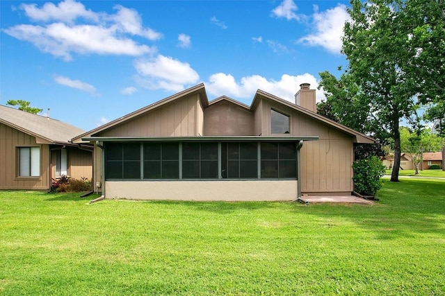 545 Mystic Wood St, Casselberry, FL 32707 - view of property exterior with a chimney, a sunroom, and a lawn