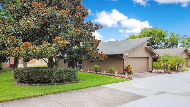 545 Mystic Wood St, Casselberry, FL 32707 - view of front of home featuring a garage, driveway, and a front lawn