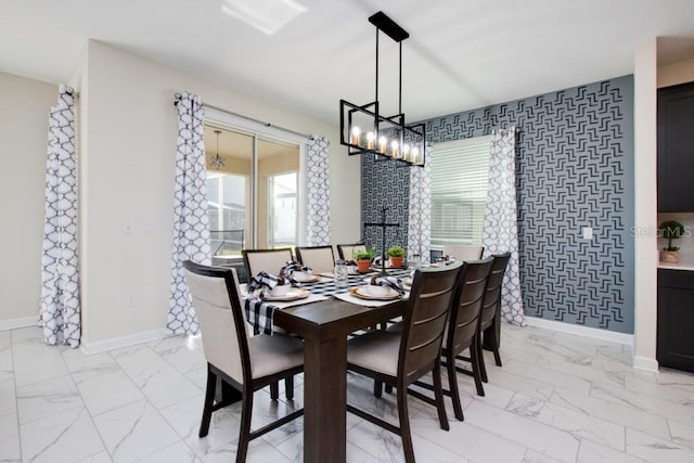 8982 Cabot Cliffs Dr, Davenport, FL 33896 - dining room with light marble finish floors and a chandelier