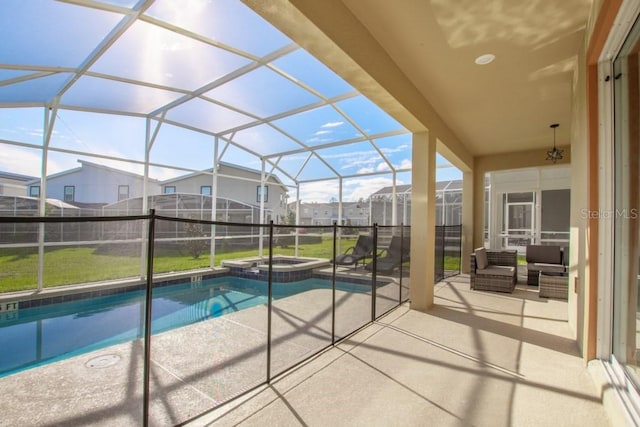 8982 Cabot Cliffs Dr, Davenport, FL 33896 - view of swimming pool with a patio, a pool with connected hot tub, a residential view, and glass enclosure