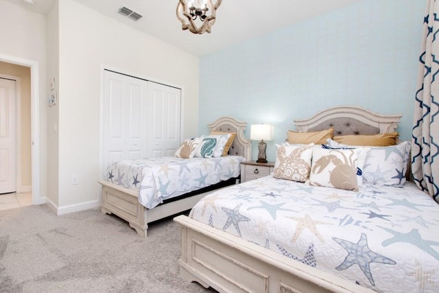 8982 Cabot Cliffs Dr, Davenport, FL 33896 - bedroom with a closet, a chandelier, and carpet flooring