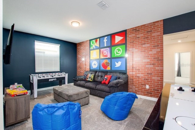 8982 Cabot Cliffs Dr, Davenport, FL 33896 - living room with brick wall, carpet, and an accent wall