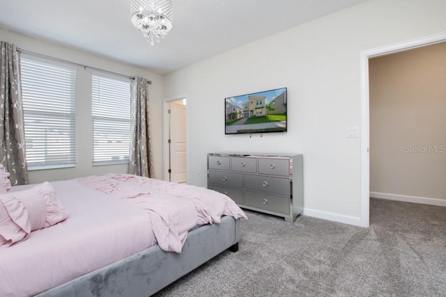 8982 Cabot Cliffs Dr, Davenport, FL 33896 - bedroom featuring carpet and a chandelier