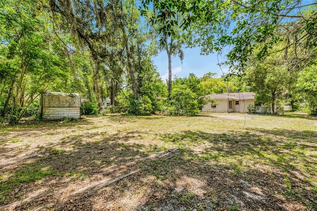 710 N Sparkman Ave, Orange City, FL 32763 - view of yard with a storage unit