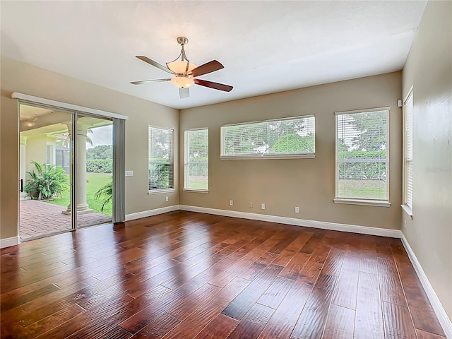 2209 Callaway Ct, Davenport, FL 33837 - unfurnished room featuring dark wood finished floors and ceiling fan