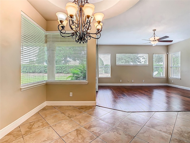 2209 Callaway Ct, Davenport, FL 33837 - unfurnished room featuring a chandelier, light tile patterned flooring, and ceiling fan