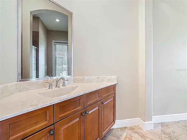 2209 Callaway Ct, Davenport, FL 33837 - bathroom with vanity and baseboards