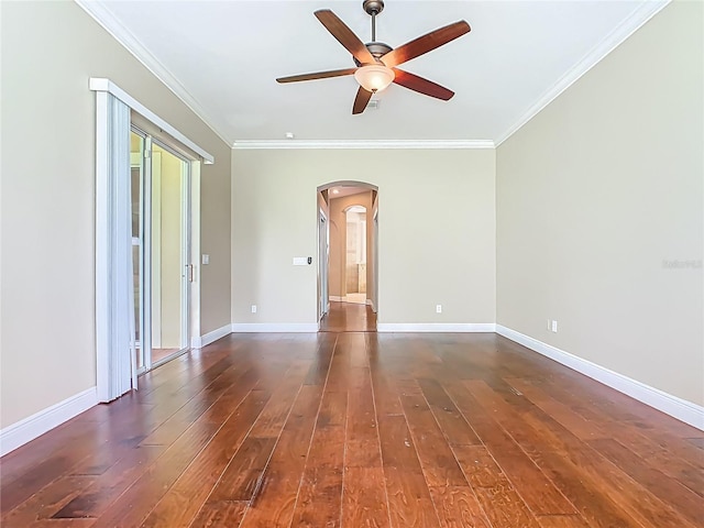 2209 Callaway Ct, Davenport, FL 33837 - unfurnished room with arched walkways, ornamental molding, dark wood-type flooring, and a ceiling fan