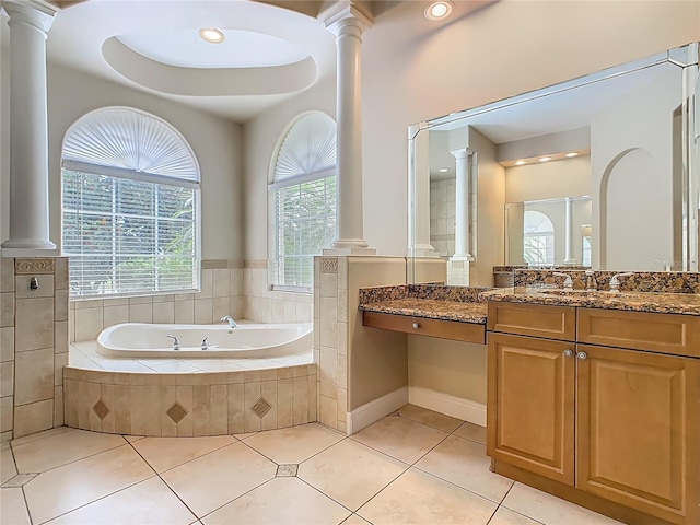 2209 Callaway Ct, Davenport, FL 33837 - full bath with decorative columns, a garden tub, vanity, and tile patterned flooring