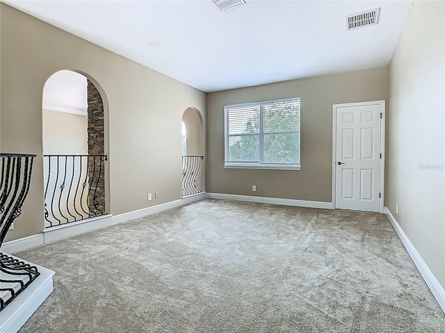 2209 Callaway Ct, Davenport, FL 33837 - spare room with arched walkways and carpet flooring