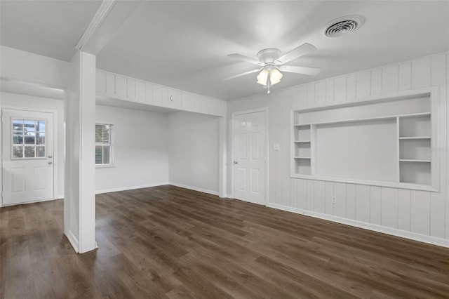 203 E Lakeview Ave, Eustis, FL 32726 - unfurnished living room featuring a ceiling fan, dark wood finished floors, and built in shelves