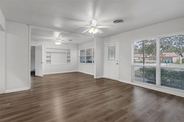 203 E Lakeview Ave, Eustis, FL 32726 - unfurnished living room with a ceiling fan, built in features, and dark wood-type flooring