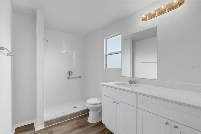 203 E Lakeview Ave, Eustis, FL 32726 - bathroom with wood finished floors, vanity, and tiled shower