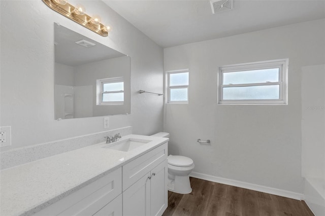203 E Lakeview Ave, Eustis, FL 32726 - full bath with vanity, wood finished floors, a shower, and a tub