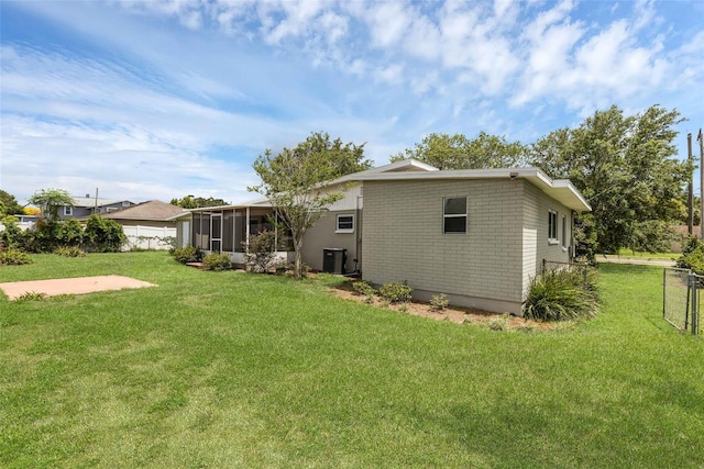 203 E Lakeview Ave, Eustis, FL 32726 - rear view of house featuring a sunroom
