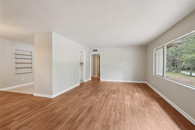 518 NW 36th Ter, Gainesville, FL 32607 - unfurnished room with light wood finished floors and baseboards