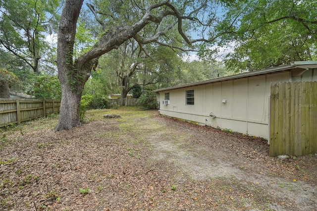 518 NW 36th Ter, Gainesville, FL 32607 - fenced backyard with an outdoor fire pit