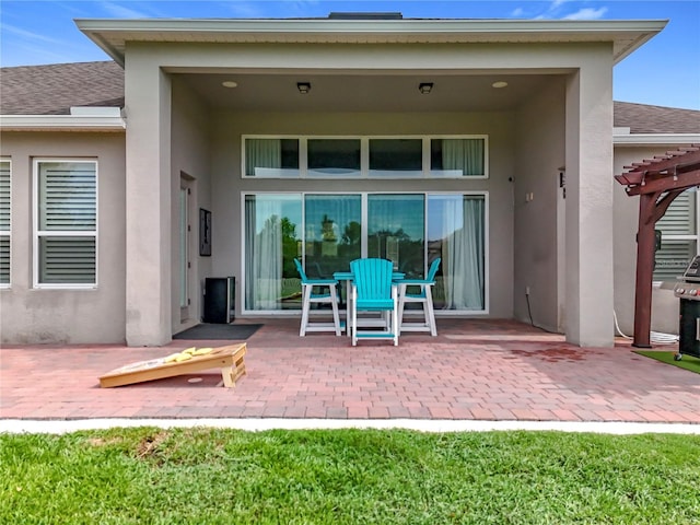 31980 Geoff Way, Sorrento, FL 32776 - back of house featuring a patio, stucco siding, roof with shingles, and a pergola