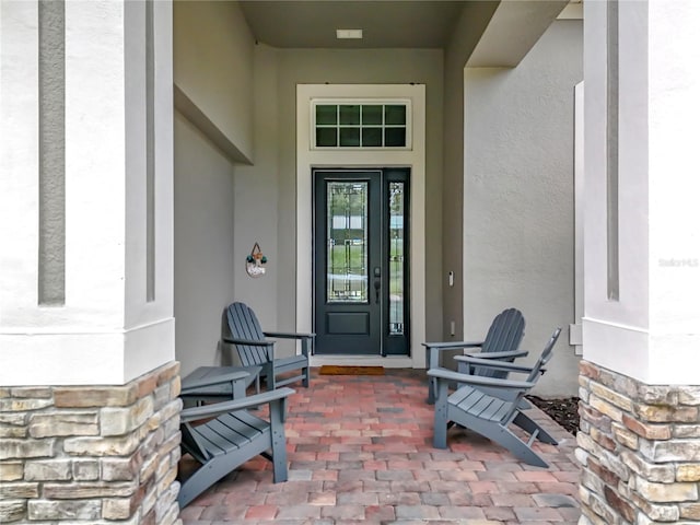 31980 Geoff Way, Sorrento, FL 32776 - property entrance featuring stone siding and stucco siding