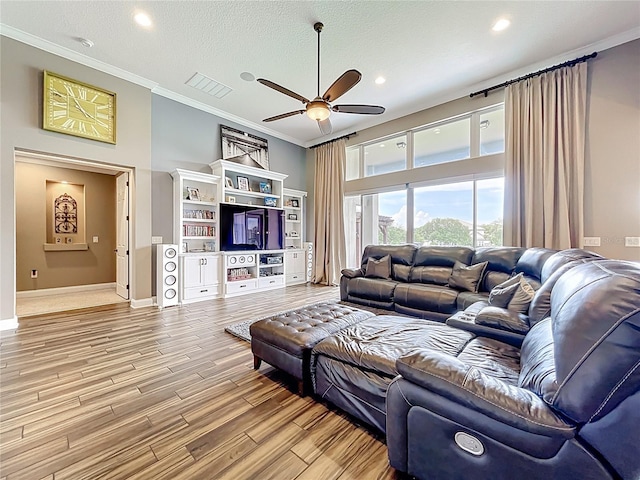 31980 Geoff Way, Sorrento, FL 32776 - living area with ceiling fan, ornamental molding, light wood-style floors, and recessed lighting